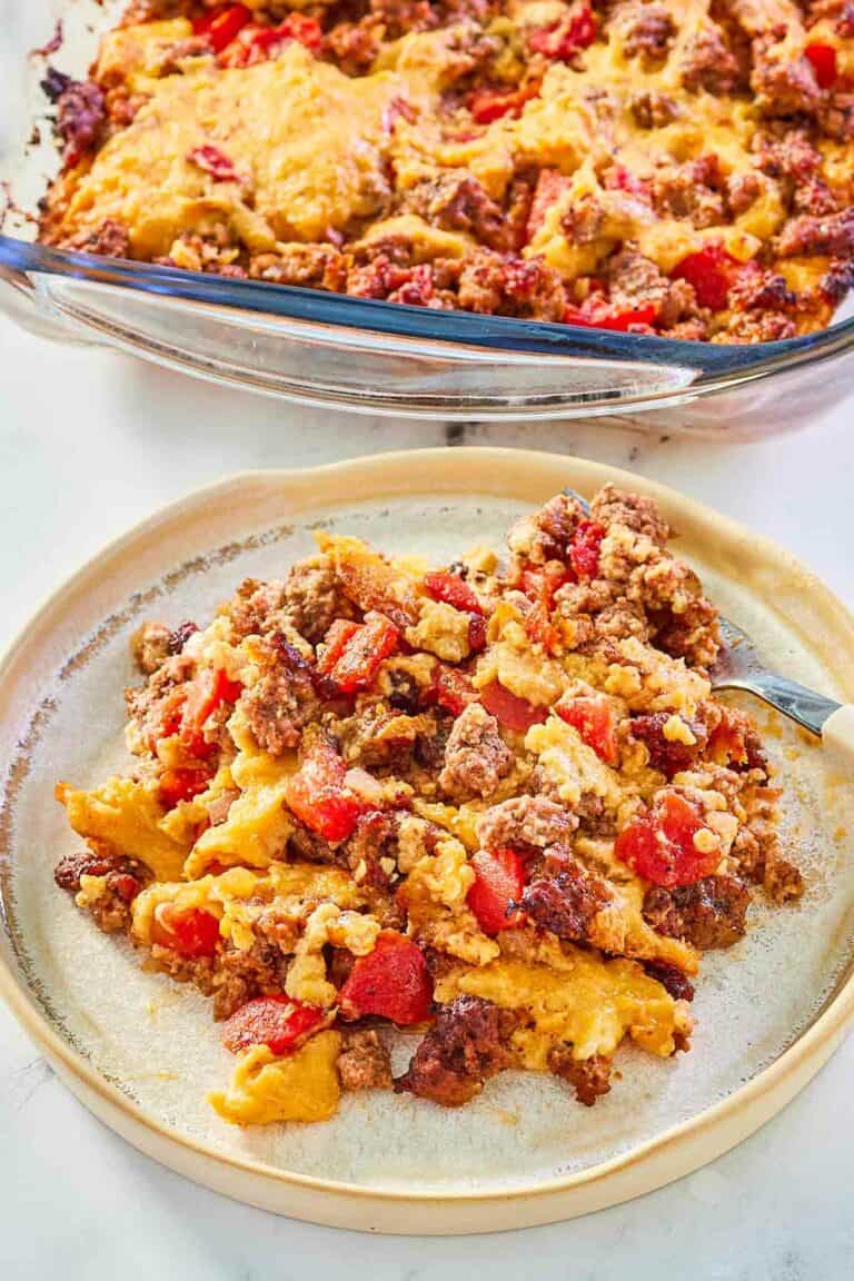 beef tamale casserole in a baking dish and a serving on a plate.