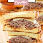 Whataburger patty melt sandwiches cut in half and stacked.
