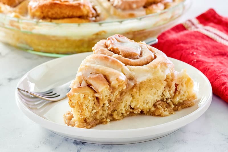 copycat Cracker Barrel cinnamon roll pie slice on a white plate.