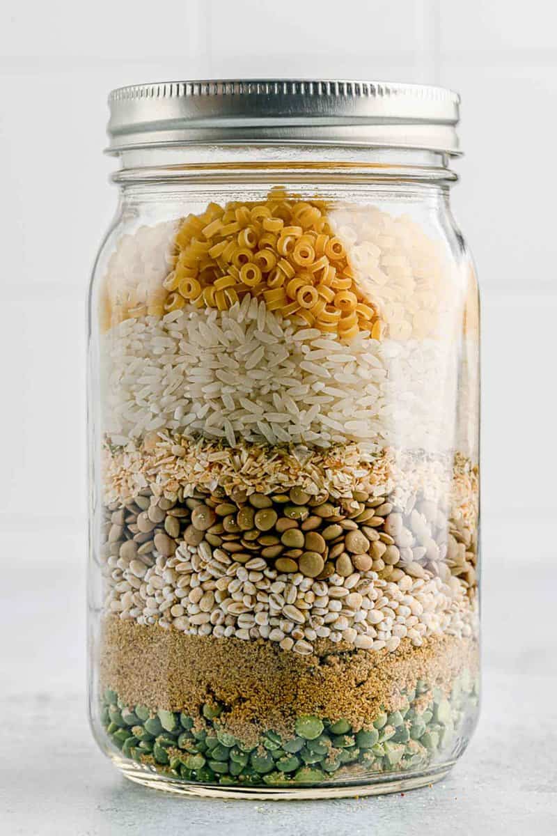 dry friendship soup mix ingredients layered in a jar.