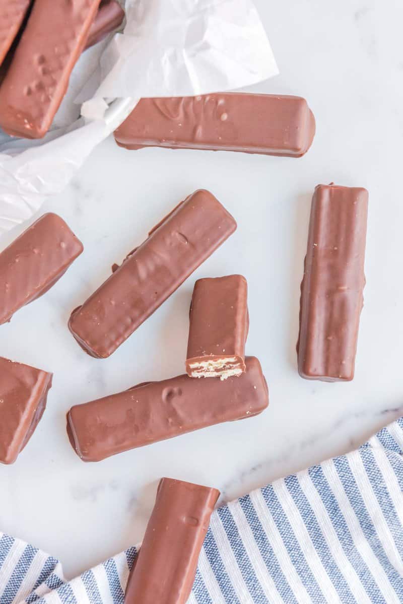 overhead view of homemade kit kat bars scattered on parchment paper.