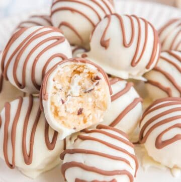 Little Debbie zebra cake truffles and one cut in half to show the inside.