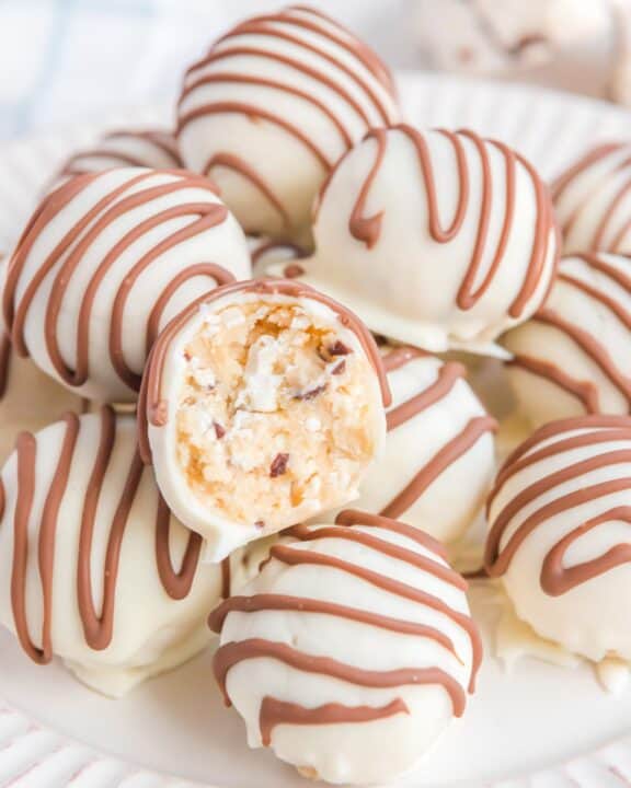 Little Debbie zebra cake truffles and one cut in half to show the inside.