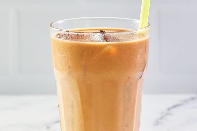 copycat McDonald's iced coffee with a straw.
