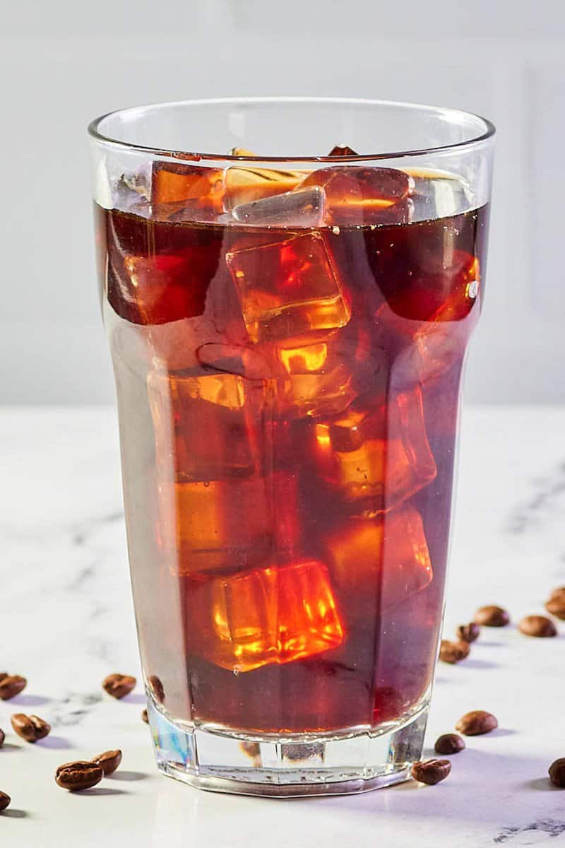 ice, coffee, and simple syrup in a glass.