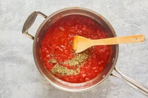 ingredients for marinara sauce in a pan.