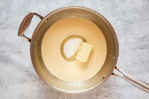 butter, sugar, and evaporated milk in a pan.