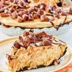 Reese's peanut butter pie slice with the pie behind it.