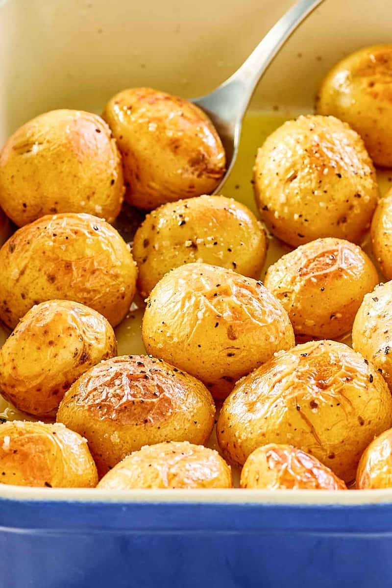closeup of roasted baby potatoes in a serving dish.