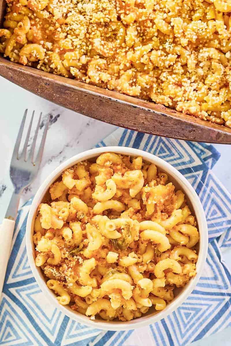 overhead view of spicy mac and cheese in a bowl and baking dish.