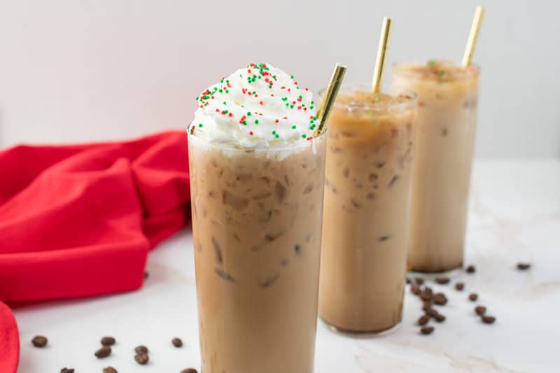 copycat Starbucks iced sugar cookie latte with whipped cream and sprinkles.