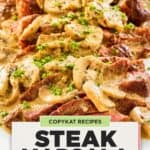Steak slices with creamy mushroom wine sauce.