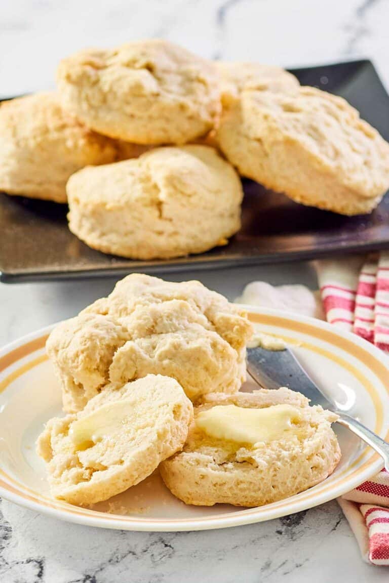 sweet biscuits on a white plate and black platter.