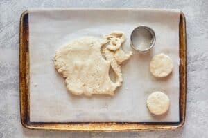 cutting dough to make sweet biscuits.