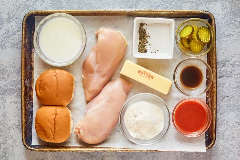 wingstop buffalo chicken sandwich ingredients on a tray.