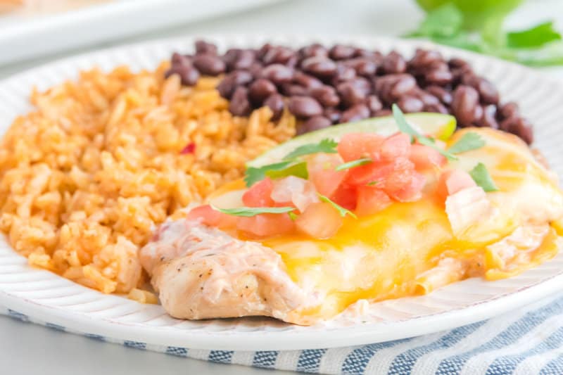 Copycat Applebee's fiesta lime chicken, black beans, and Mexican rice on a plate.