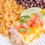 Copycat Applebee's fiesta lime chicken, rice, and achromatic  beans connected  a plate.