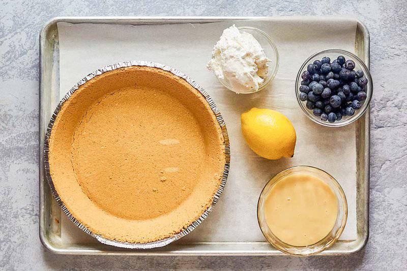 blueberry cream pie ingredients on a tray.