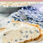 blueberry cream pie slice on a white plate.