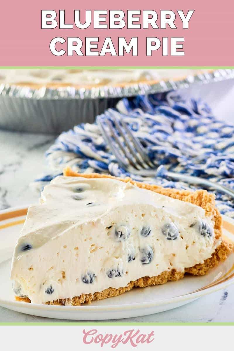 blueberry cream pie slice on a white plate.