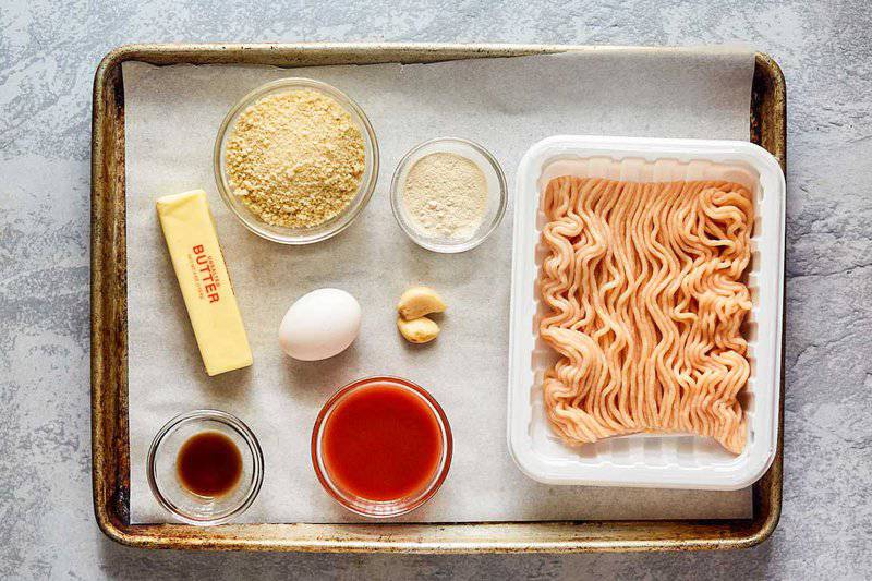 Buffalo chicken meatballs ingredients on a tray.