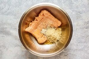 ingredients for chicken meatballs in a mixing bowl.