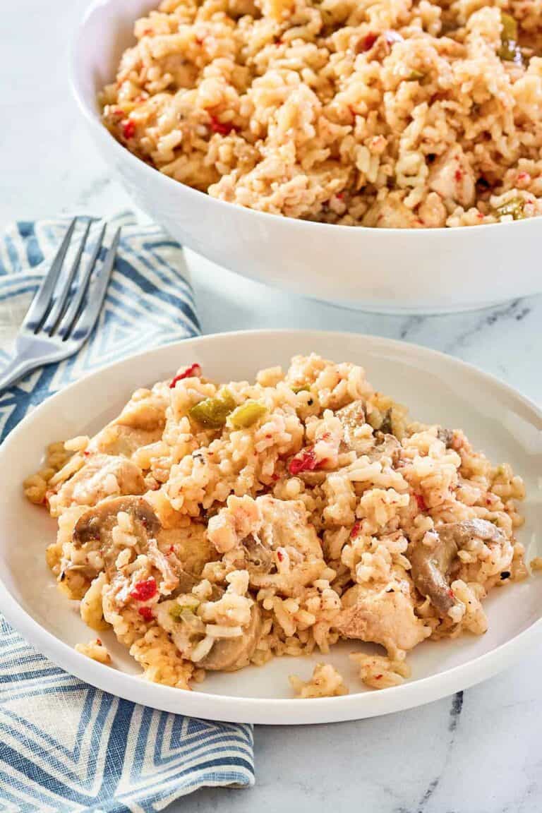 chicken and rice casserole in a serving bowl and on a plate.