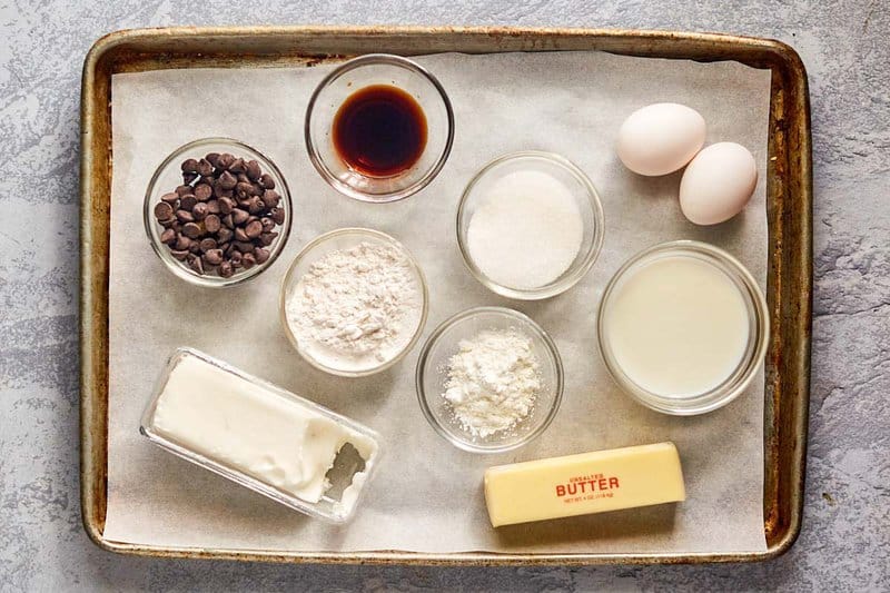 ingredients for chocolate eclairs on a tray.