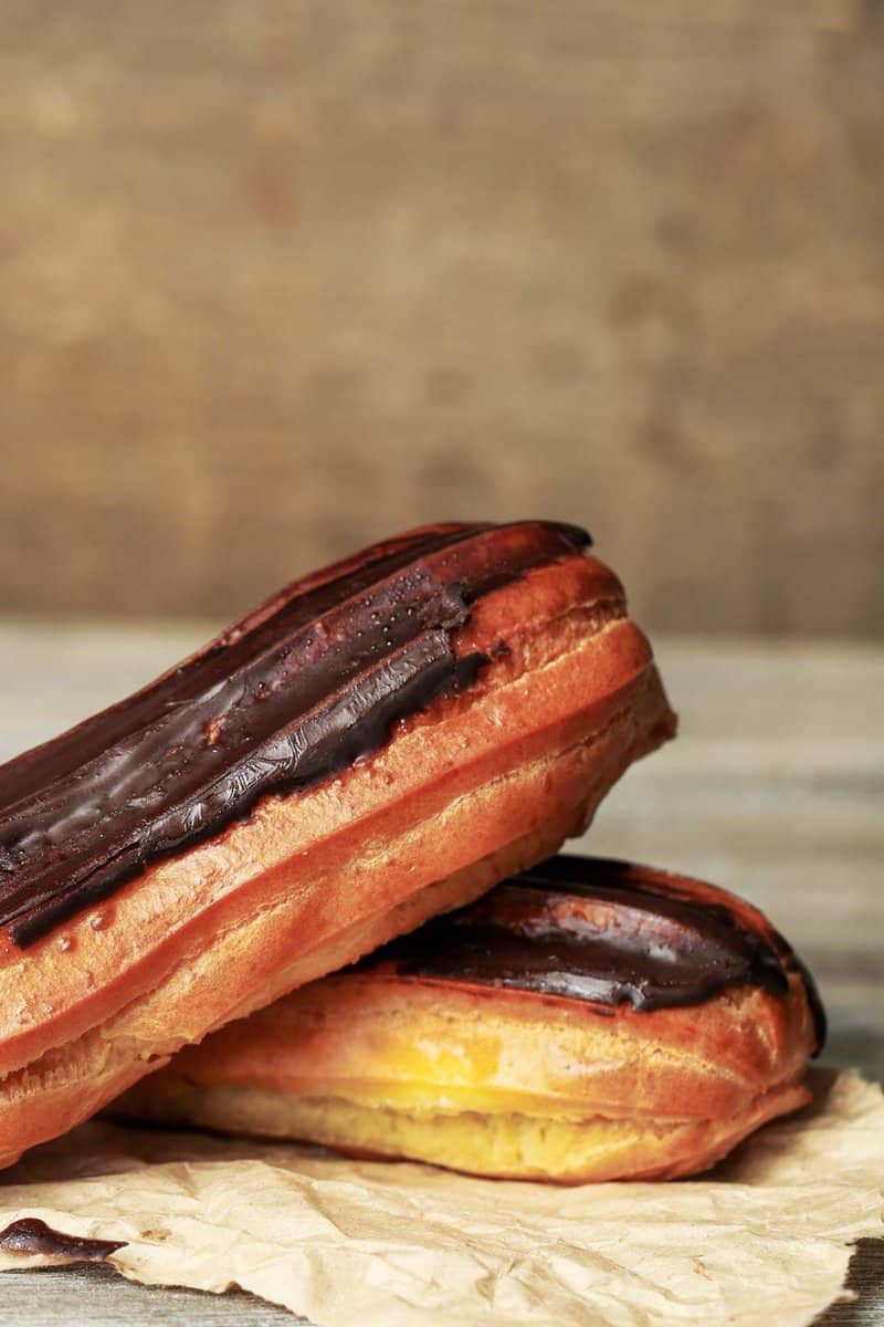 closeup of two chocolate eclairs.