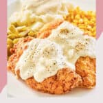 copycat Cracker Barrel chicken fried chicken with gravy and vegetables on a plate.