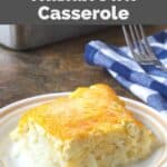 copycat cracker barrel hashbrown casserole and a fork on a napkin behind it.