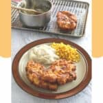 copycat cracker barrel sunday chicken on a plate with potatoes and corn.