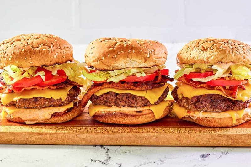 three copycat McDonald's Smoky BLT quarter pounder with cheese burgers.