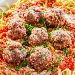 Copycat Olive Garden spaghetti and meatballs on a platter.