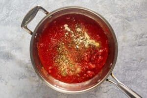 Marinara sauce ingredients in a pan.