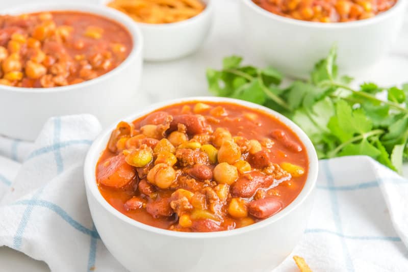 Bowls of copycat Panera turkey chili and fresh cilantro.