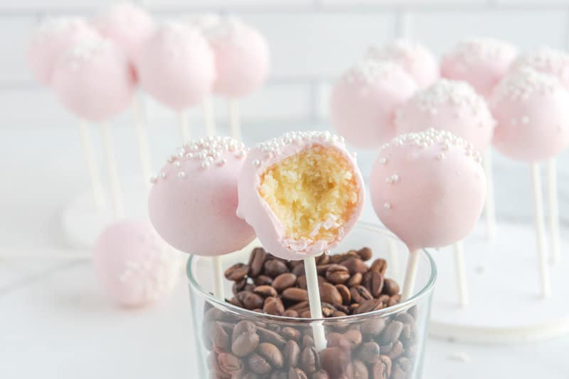 Copycat Starbucks cake pops in a glass with coffee beans.