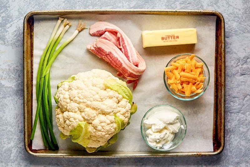 Twice baked cauliflower ingredients on a tray.