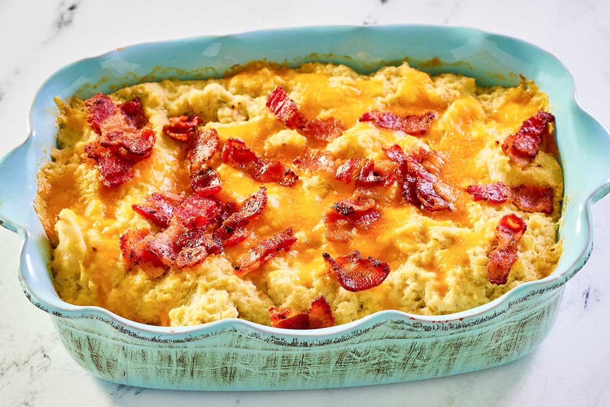 Twice baked cauliflower in a casserole dish.