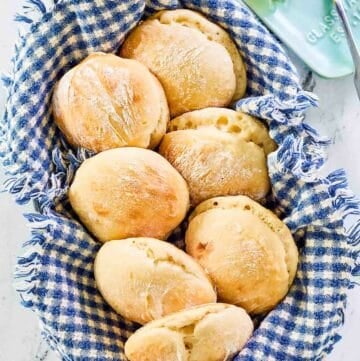 Overhead view of angel biscuits in a basket.