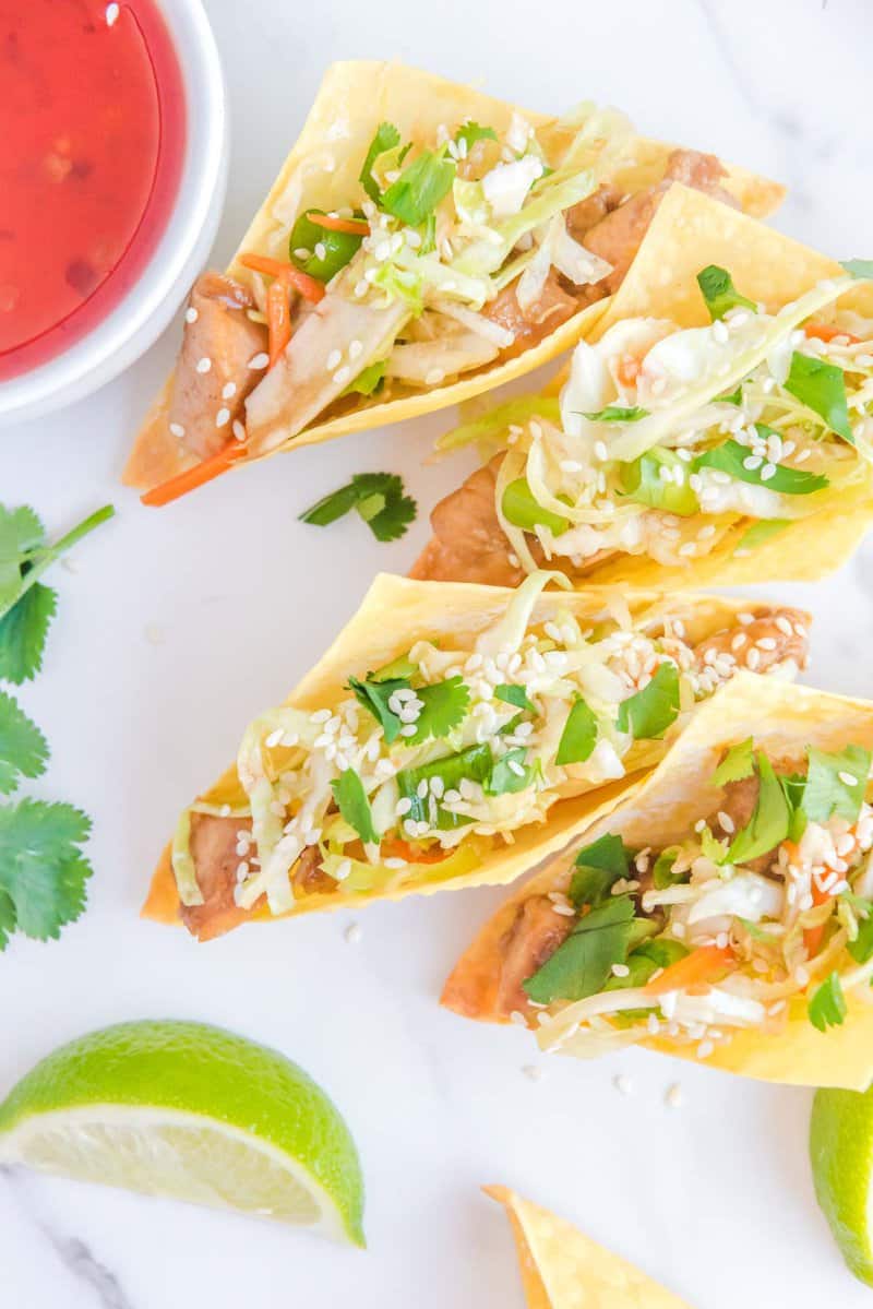 Overhead view of four copycat Applebee's yellow wonton tacos.