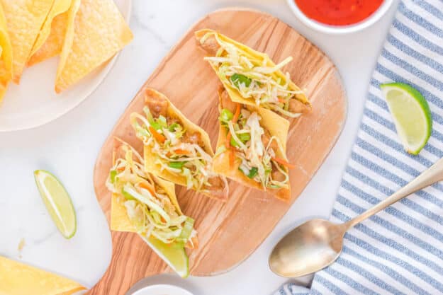 Wonton taco shells filled with chicken and Asian slaw.
