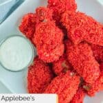 Overhead view of homemade Applebee's Flamin Hot Cheetos wings on a plate.