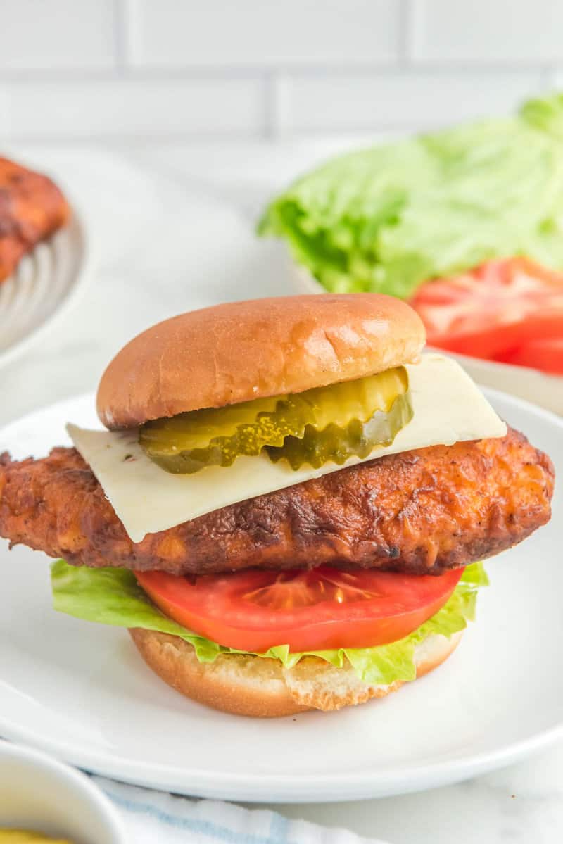 Copycat Chick Fil A spicy deluxe chicken sandwich on a plate.