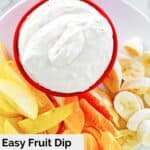 Overhead view of cool whip fruit dip on a plate with fresh fruit.