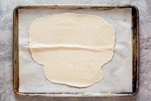 Rolled out dough for homemade crackers.