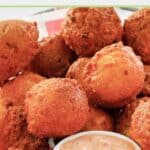 Closeup of homemade southern cornbread hush puppies in a basket.