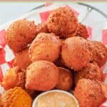 Homemade southern cornbread hush puppies in a basket.