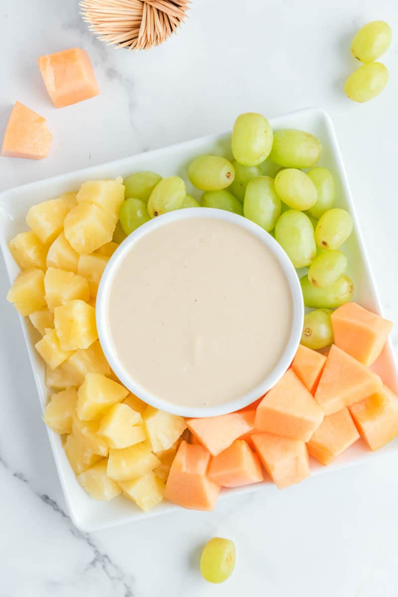 Overhead view of copycat Jason's Deli fruit dip and fresh fruit.