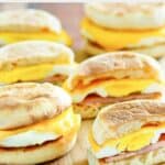 Several homemade McDonald's egg mcmuffin breakfast sandwiches.